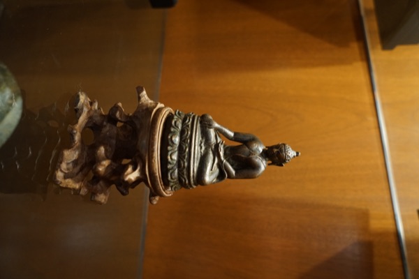 Small Seated Figure On Root Stand
