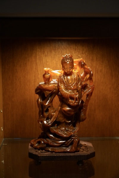Carved Standing Figure With Vase